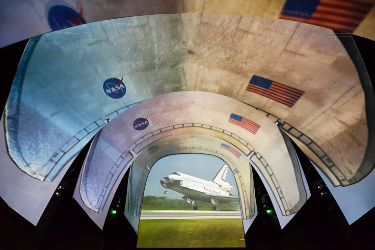 Atlantis Space Shuttle Projection on the arched Fellert Acoustic Plaster screen